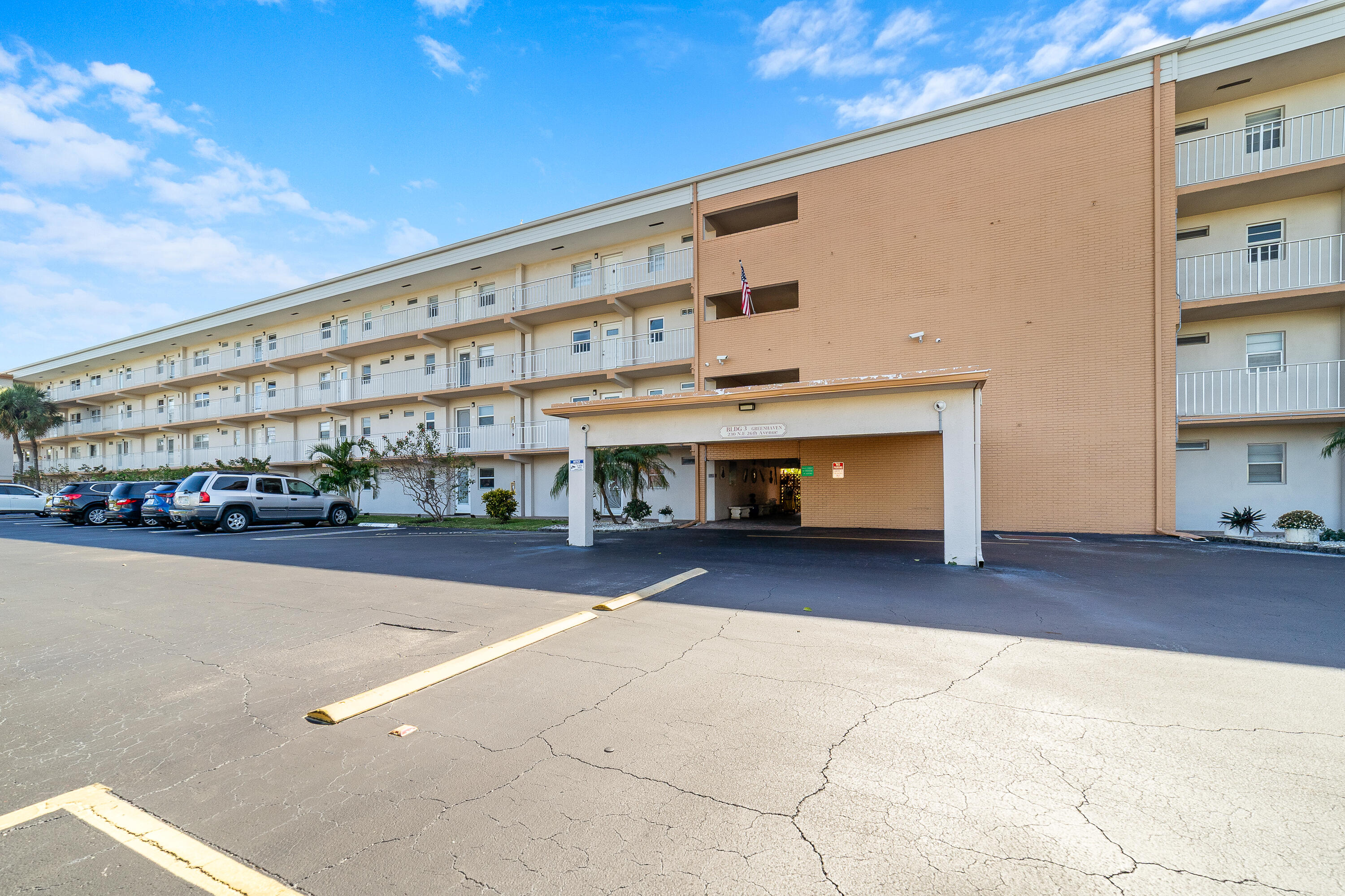 230 Northeast 26th Avenue, Unit 3020 Boynton Beach, FL 33435 - Photo 26 of 44 a large building with a large window