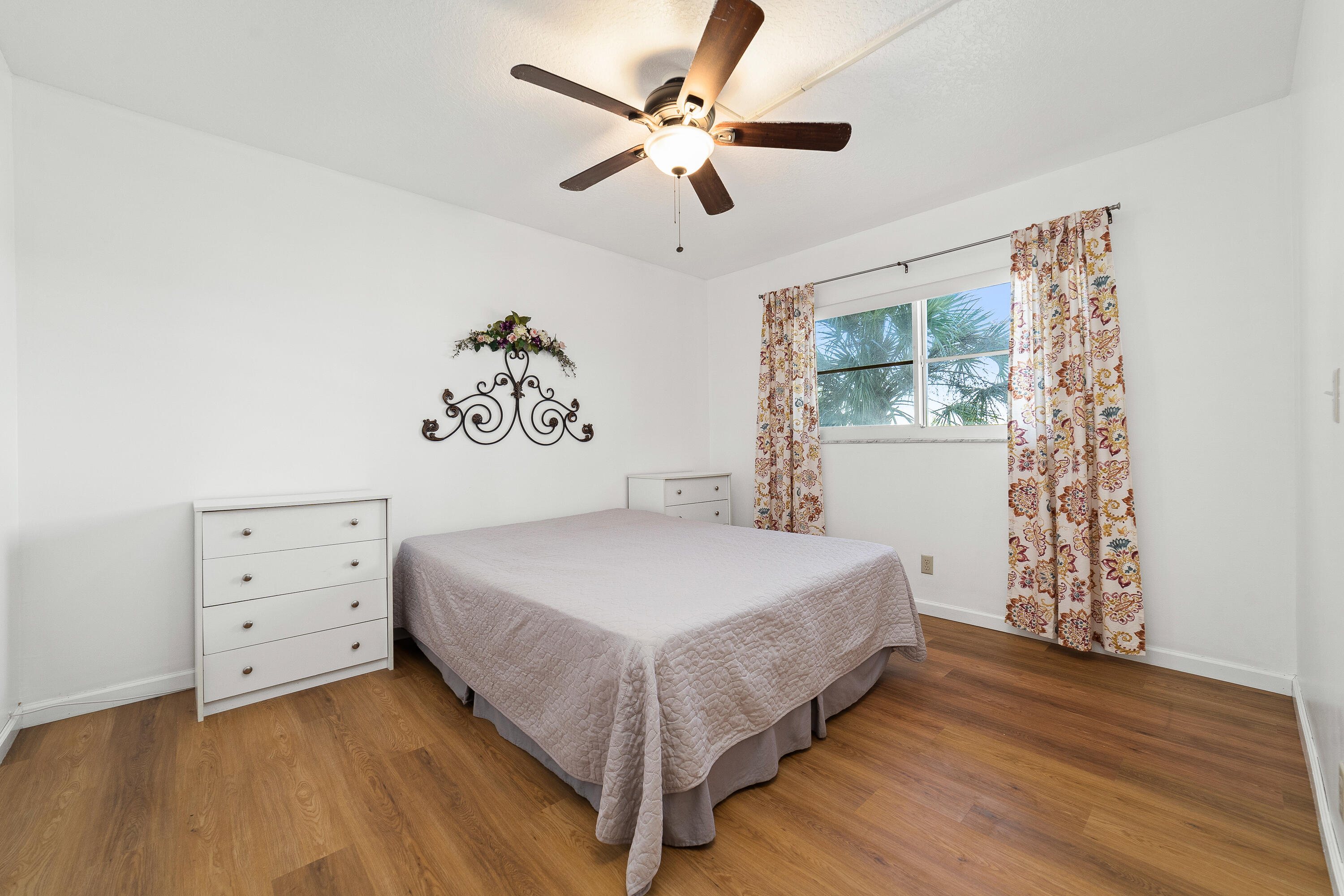 230 Northeast 26th Avenue, Unit 3020 Boynton Beach, FL 33435 - Photo 28 of 44 a bedroom with a bed and a window