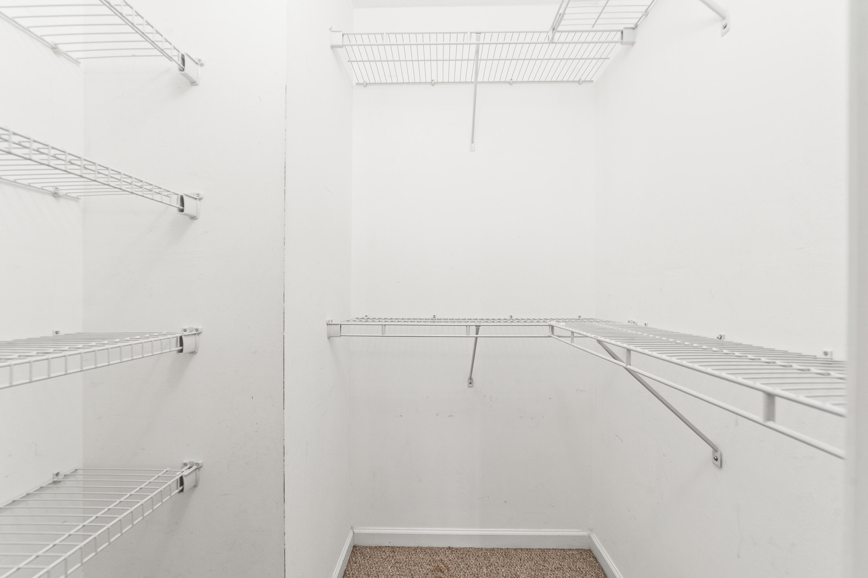 230 Northeast 26th Avenue, Unit 3020 Boynton Beach, FL 33435 - Photo 31 of 44 a view of a room with racks on the wall