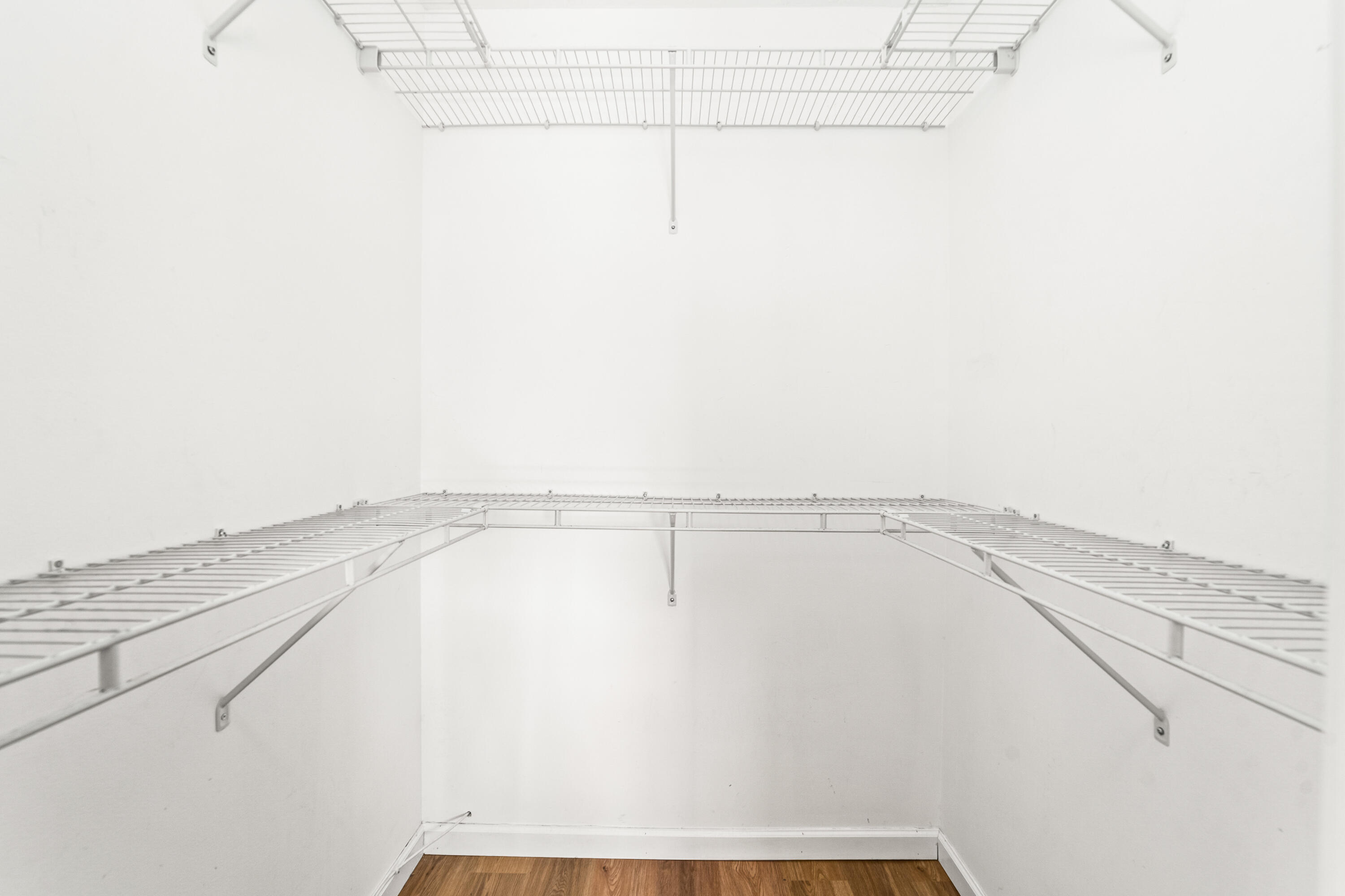 230 Northeast 26th Avenue, Unit 3020 Boynton Beach, FL 33435 - Photo 37 of 44 a view of a room with racks on the wall