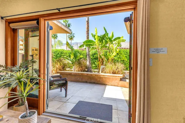 a room with pool table and windows