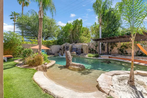 a view of a swimming pool with a patio