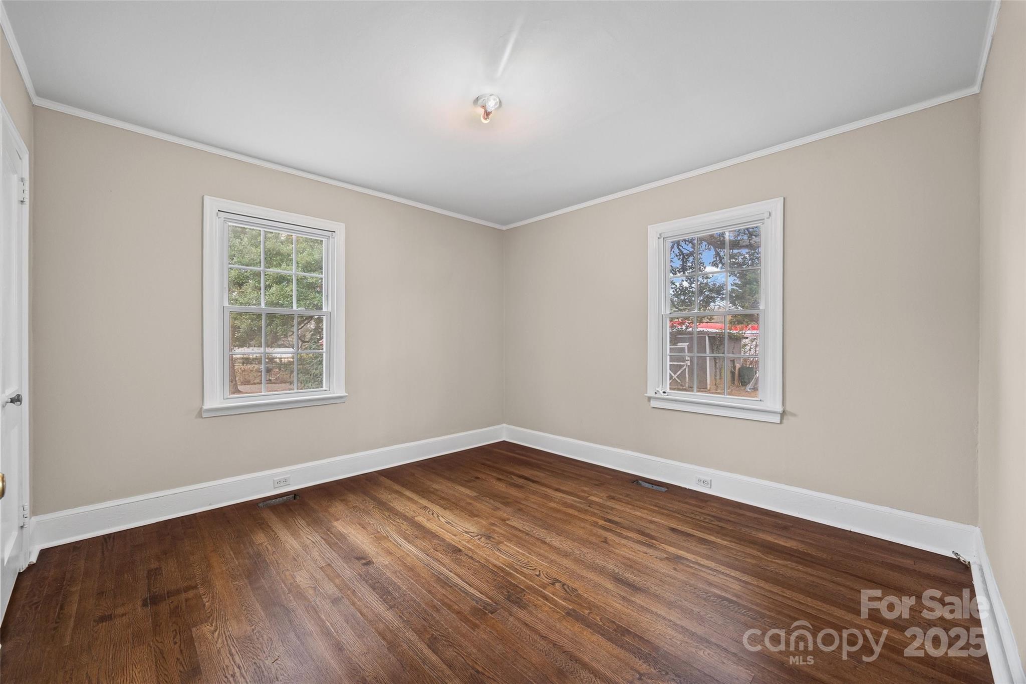 1315 Eisenhower Road Rock Hill, SC 29732 - Photo 11 of 21 a view of an empty room with wooden floor and a window