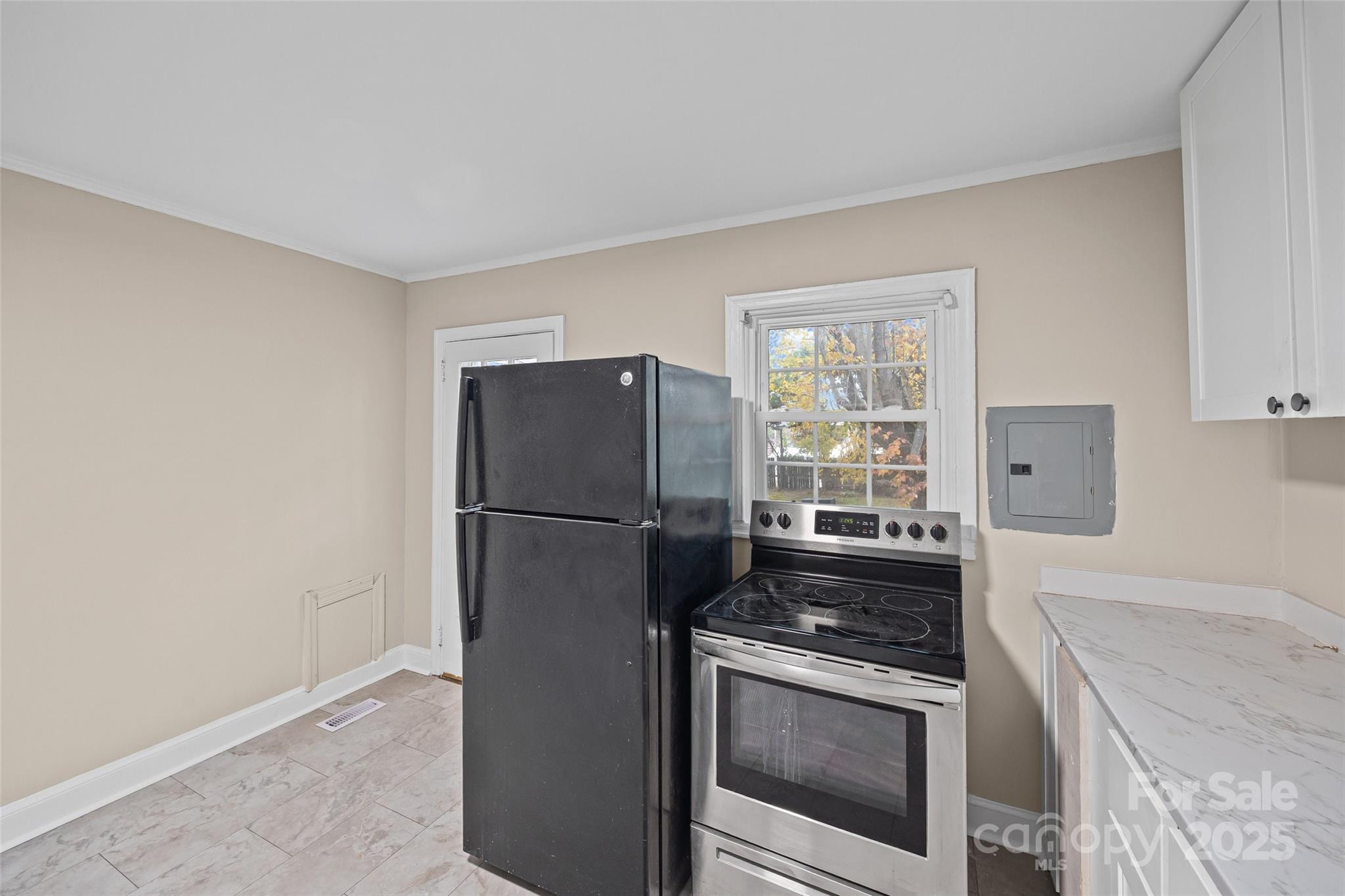 1315 Eisenhower Road Rock Hill, SC 29732 - Photo 15 of 21 a kitchen with a stove a fridge and a sink
