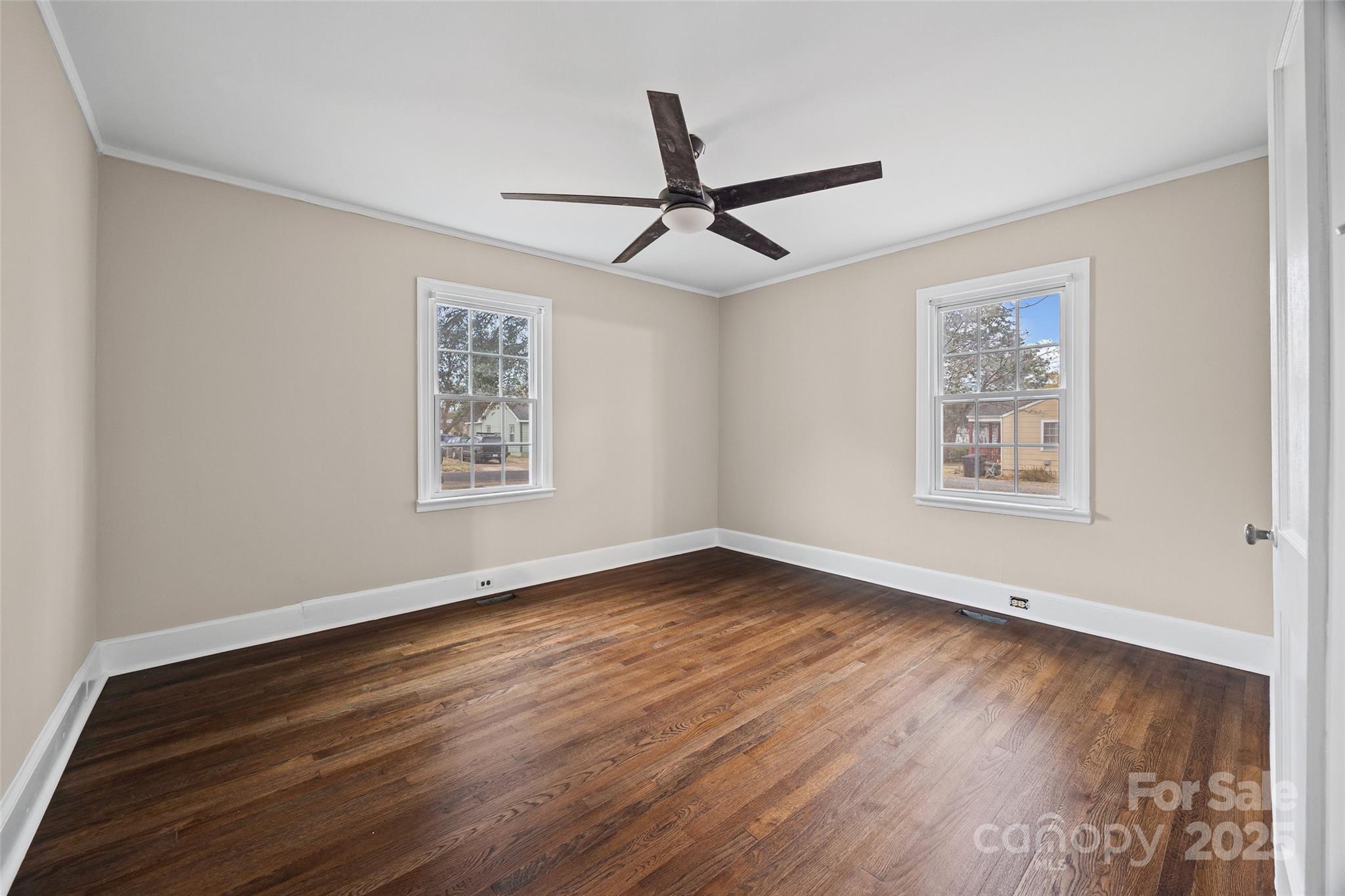 1315 Eisenhower Road Rock Hill, SC 29732 - Photo 9 of 21 a view of an empty room with wooden floor and a window