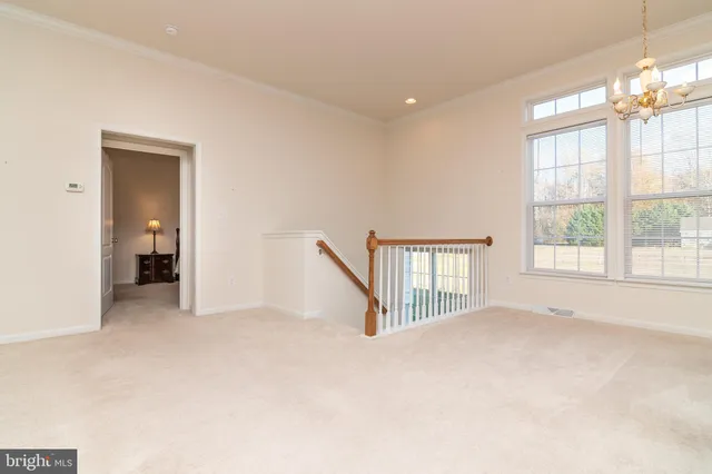 a view of empty room with a fireplace