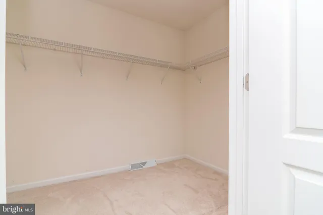 a view of a room with a hallway