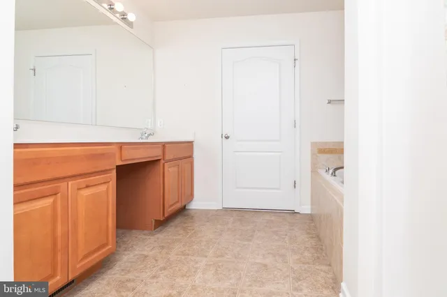 a bathroom with a bathtub and shower
