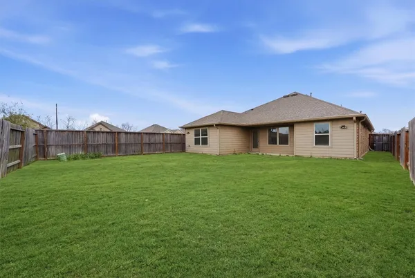 a view of a house with a big yard