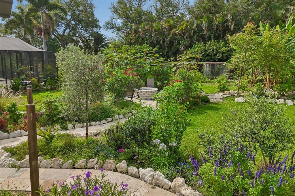 1875 Belleair Road Clearwater, FL 33764 - Photo 96 of 100 a view of a garden with a fountain