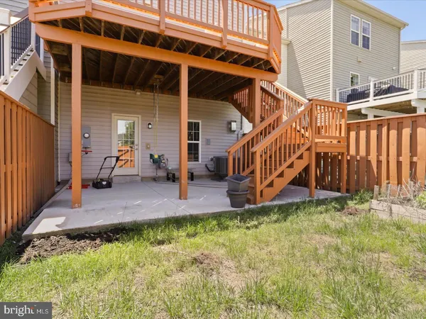 a view of a house with a yard patio and deck