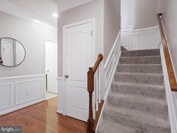 a view of an entryway with wooden floor