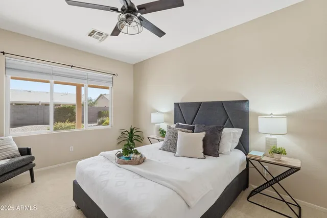 a bedroom with a bed and window