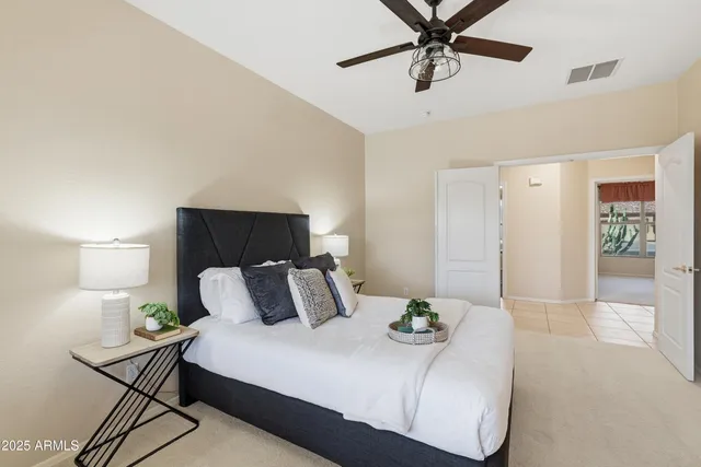 a bedroom with a bed and window