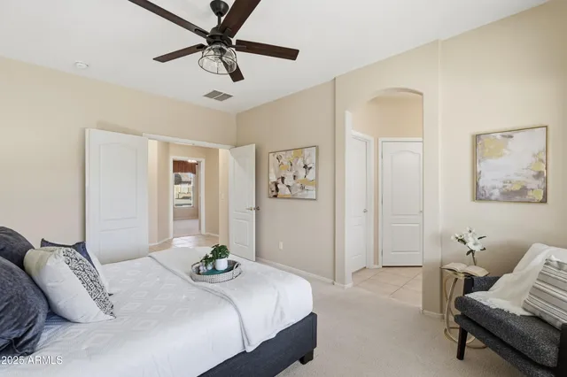 a bedroom with a bed and couch