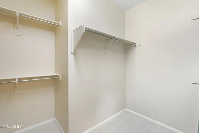 a view of an empty walk in closet