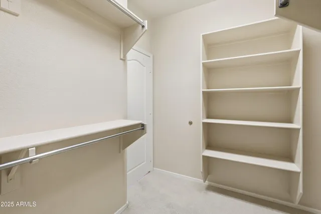 a view of an empty walk in closet