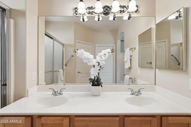 a bathroom with a sink vanity and a mirror