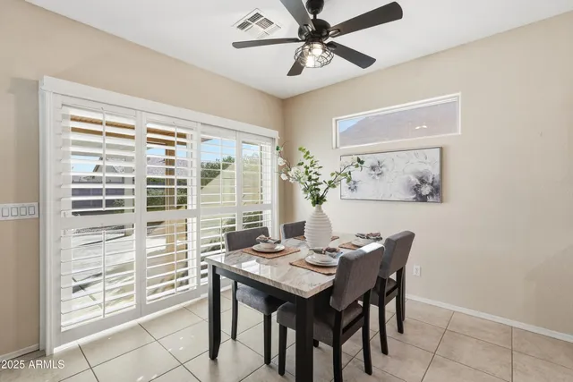 a view of a dining room with furniture window and outside view