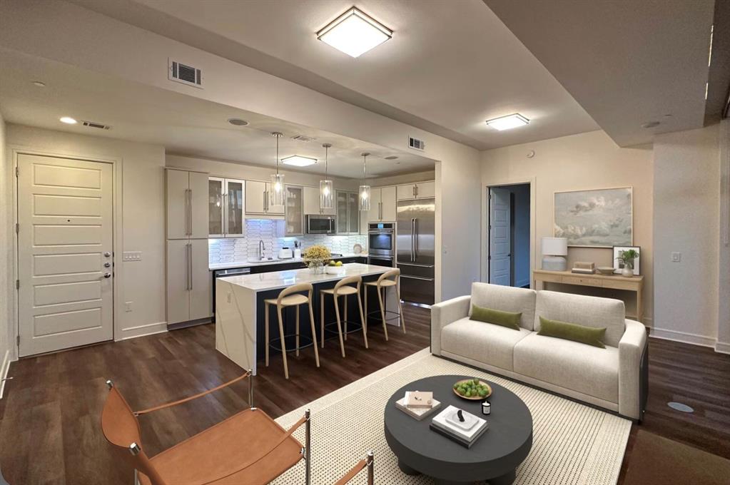 1700 Cedar Springs Road, Unit 2501 Dallas, TX 75201 - Photo 2 of 31 a living room with stainless steel appliances furniture and kitchen view