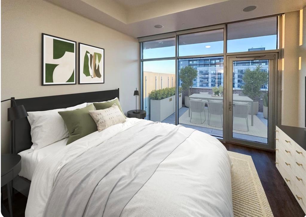 1700 Cedar Springs Road, Unit 2501 Dallas, TX 75201 - Photo 4 of 31 a bedroom with a large bed and a large window