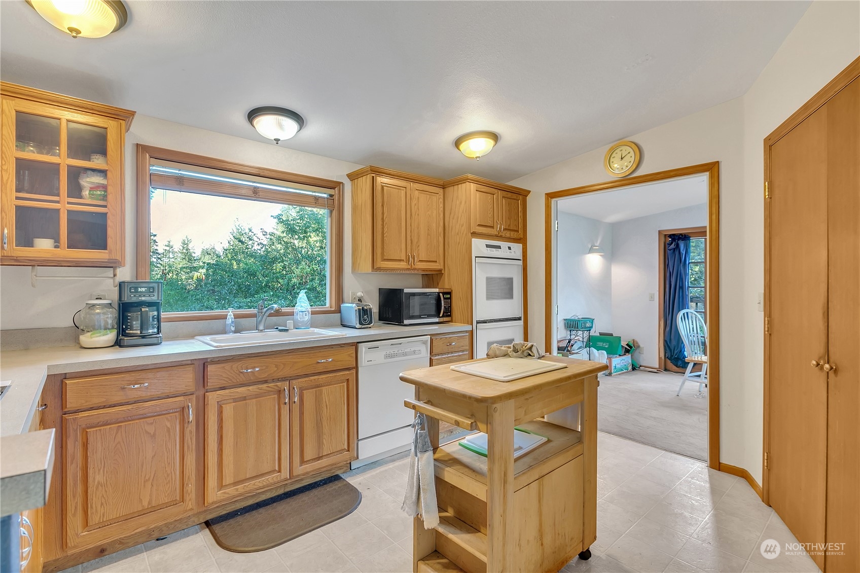 8198 Lusk Road Concrete, WA 98237 - Photo 12 of 36 a kitchen with a sink stove and cabinets