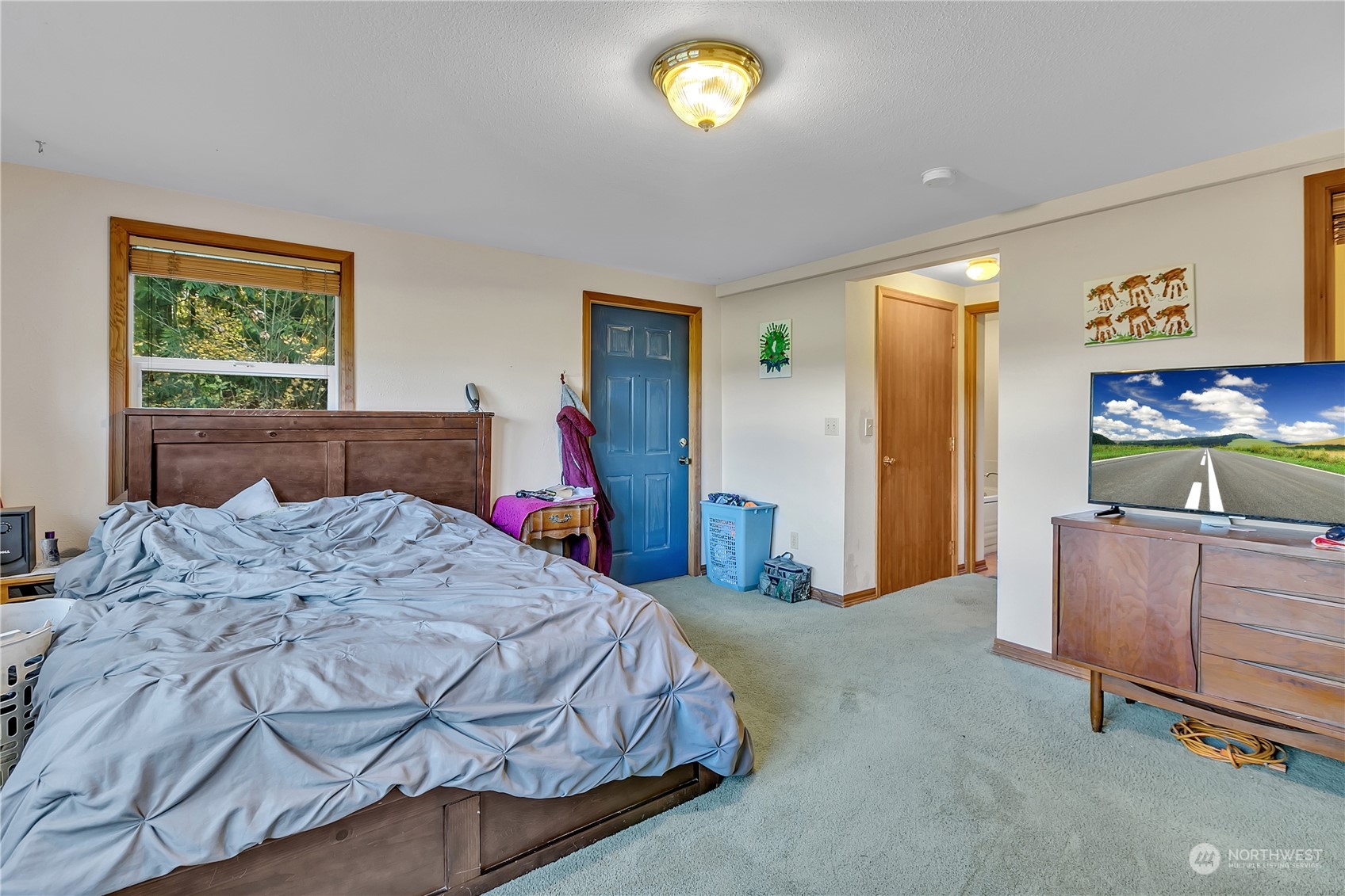 8198 Lusk Road Concrete, WA 98237 - Photo 20 of 36 a bed room with a bed and a television
