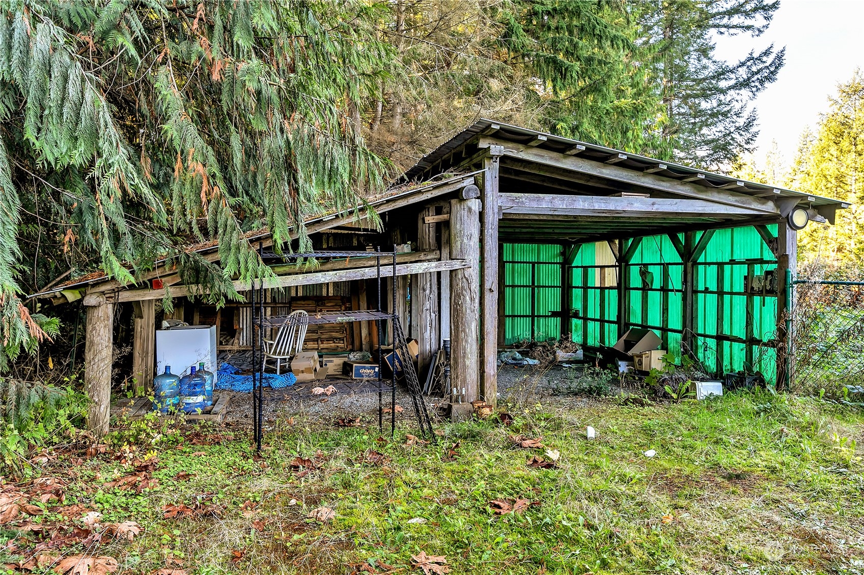 8198 Lusk Road Concrete, WA 98237 - Photo 30 of 36 a backyard of a house with yard and outdoor seating