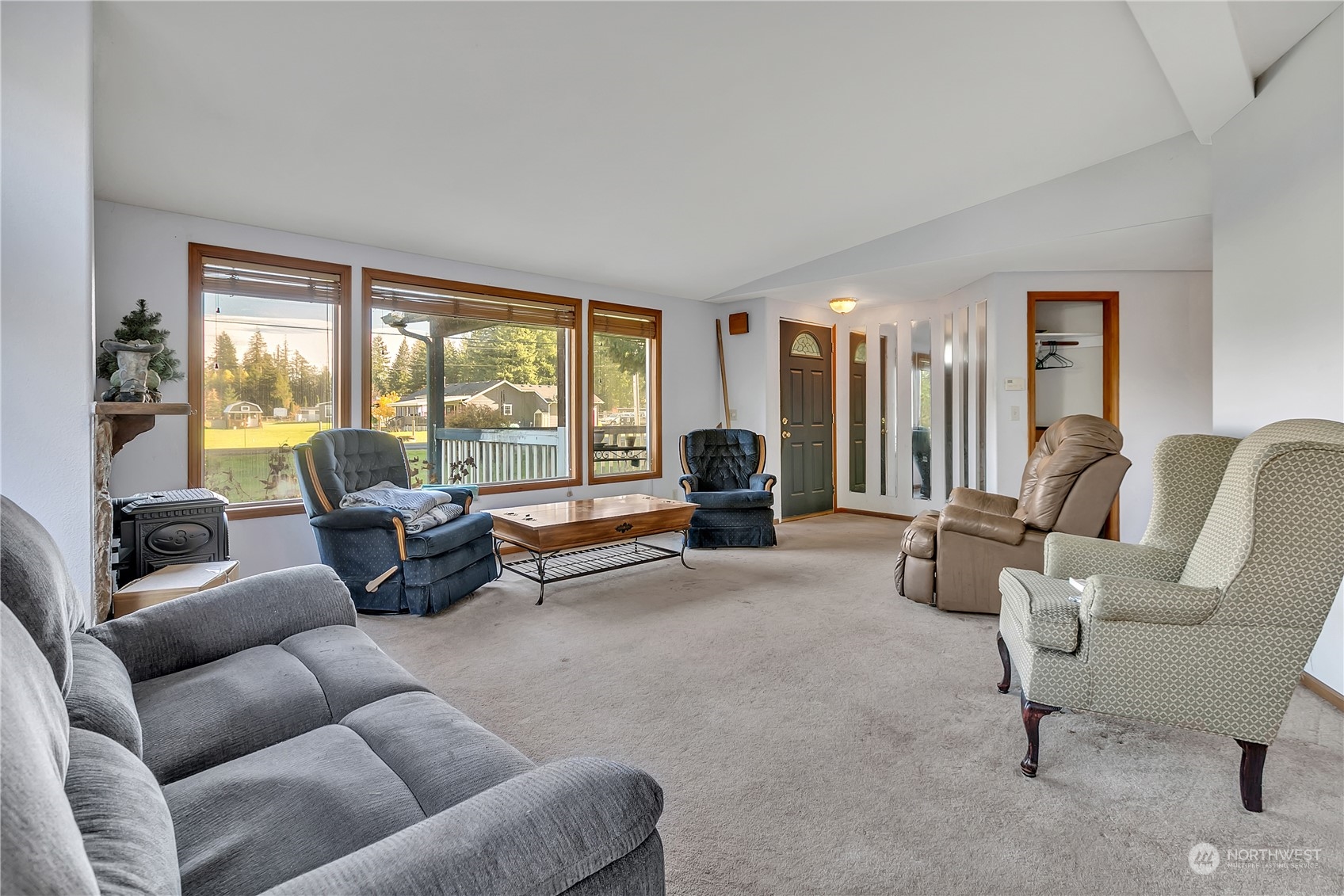 8198 Lusk Road Concrete, WA 98237 - Photo 8 of 36 a living room with furniture and a large window