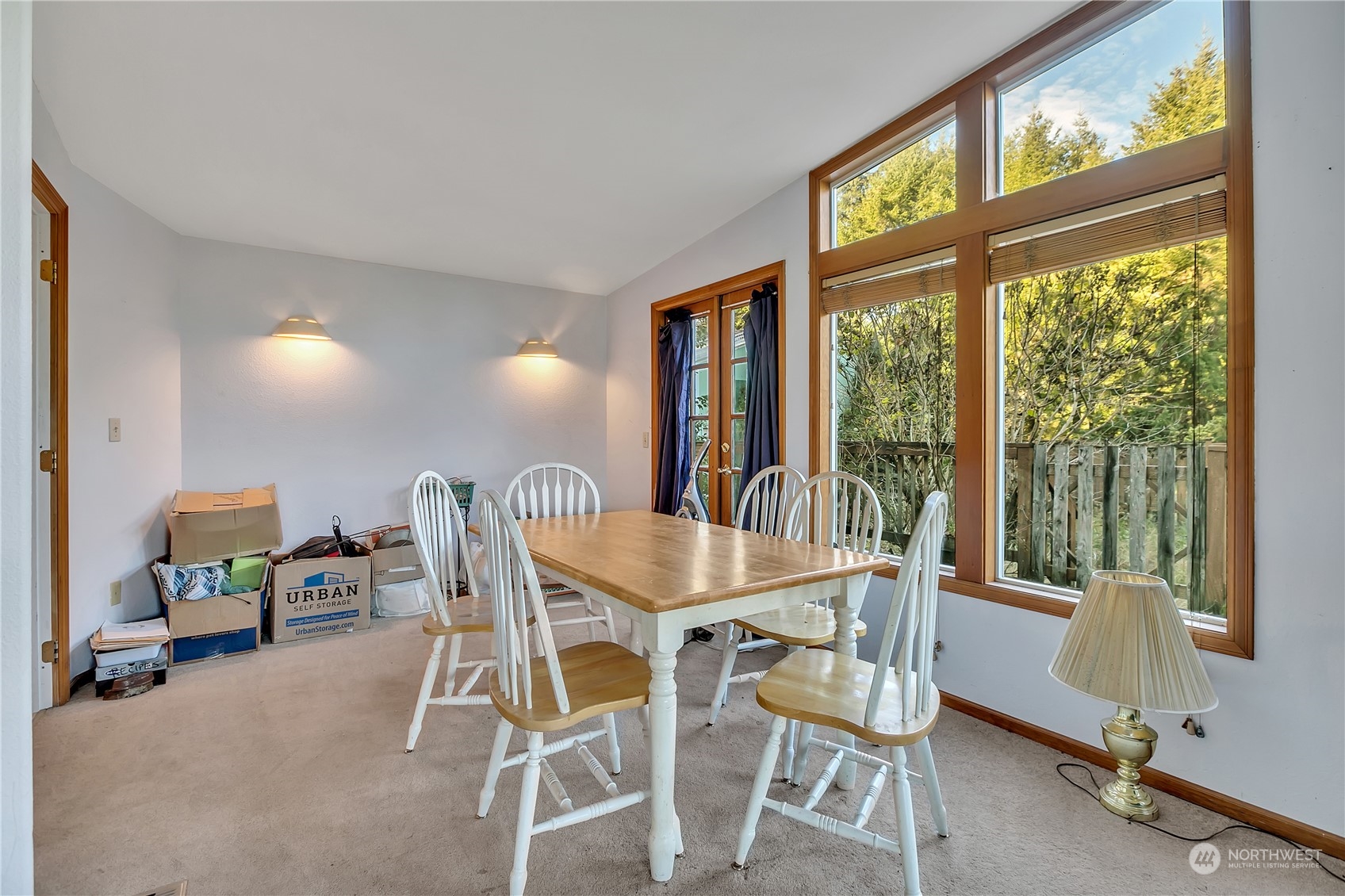 8198 Lusk Road Concrete, WA 98237 - Photo 9 of 36 a dining room with furniture and a floor to ceiling window