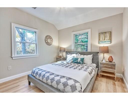 122 Pond Brook Road Newton, MA 02467 - Photo 19 of 24 a bedroom with a bed and a painting on the wall