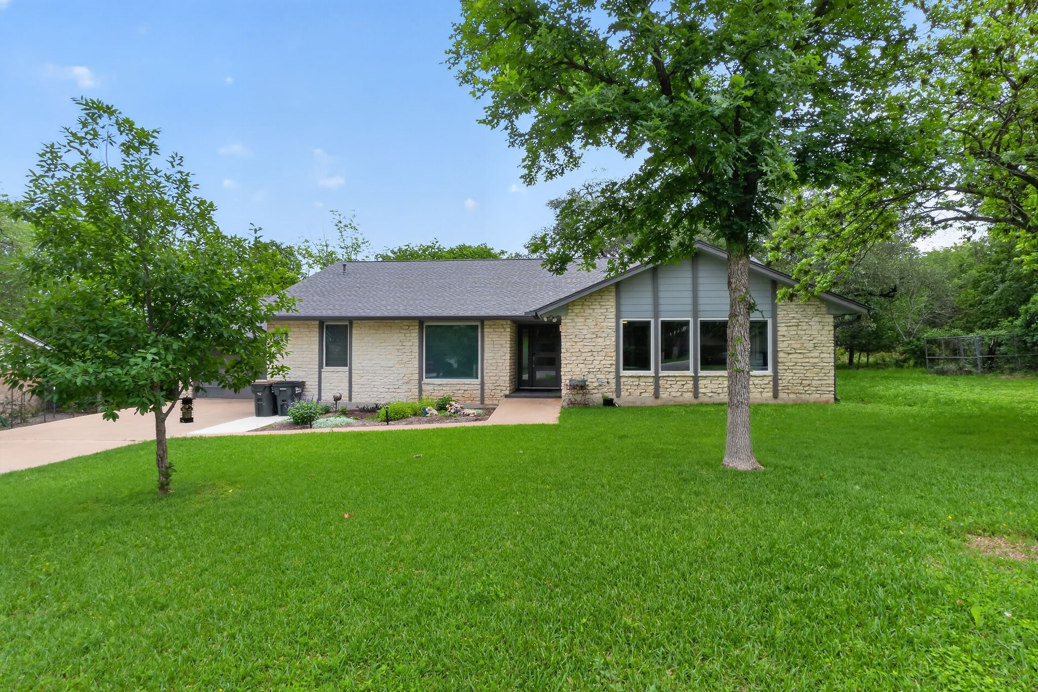 513 Meadowbrook Drive Georgetown, TX 78628 - Photo 2 of 22 a front view of house with a garden