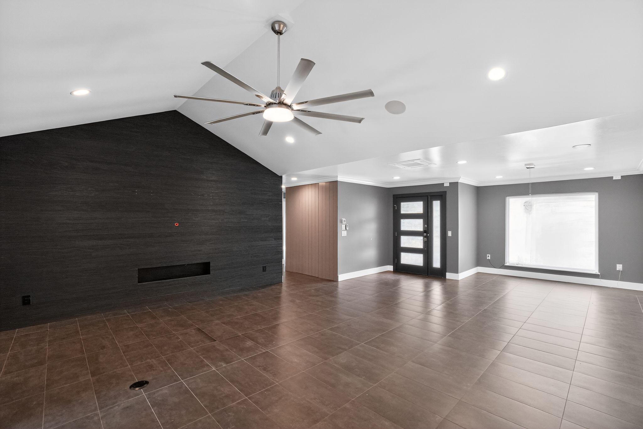 513 Meadowbrook Drive Georgetown, TX 78628 - Photo 5 of 22 an empty room with chandelier fan and windows