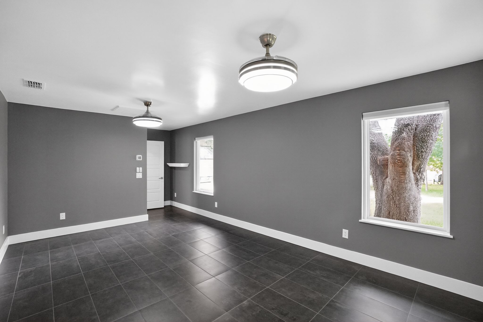 513 Meadowbrook Drive Georgetown, TX 78628 - Photo 6 of 22 an empty room with windows and fan