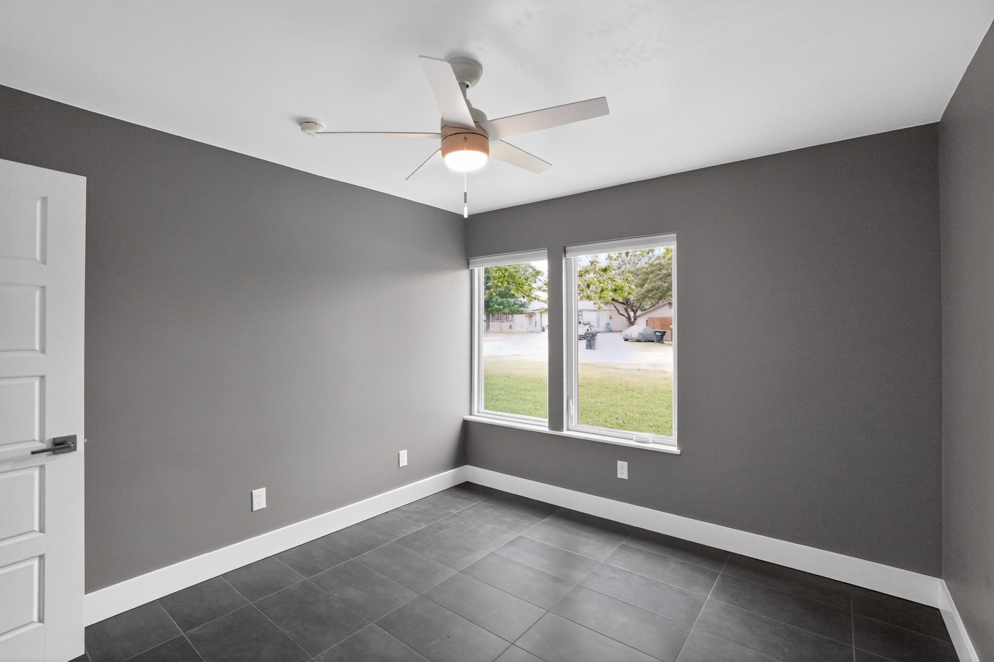 513 Meadowbrook Drive Georgetown, TX 78628 - Photo 7 of 22 an empty room with windows and ceiling fan