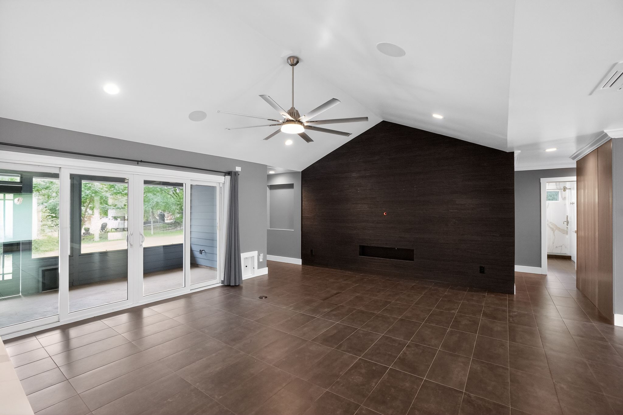 513 Meadowbrook Drive Georgetown, TX 78628 - Photo 9 of 22 a view of an empty room with a fireplace and a large window
