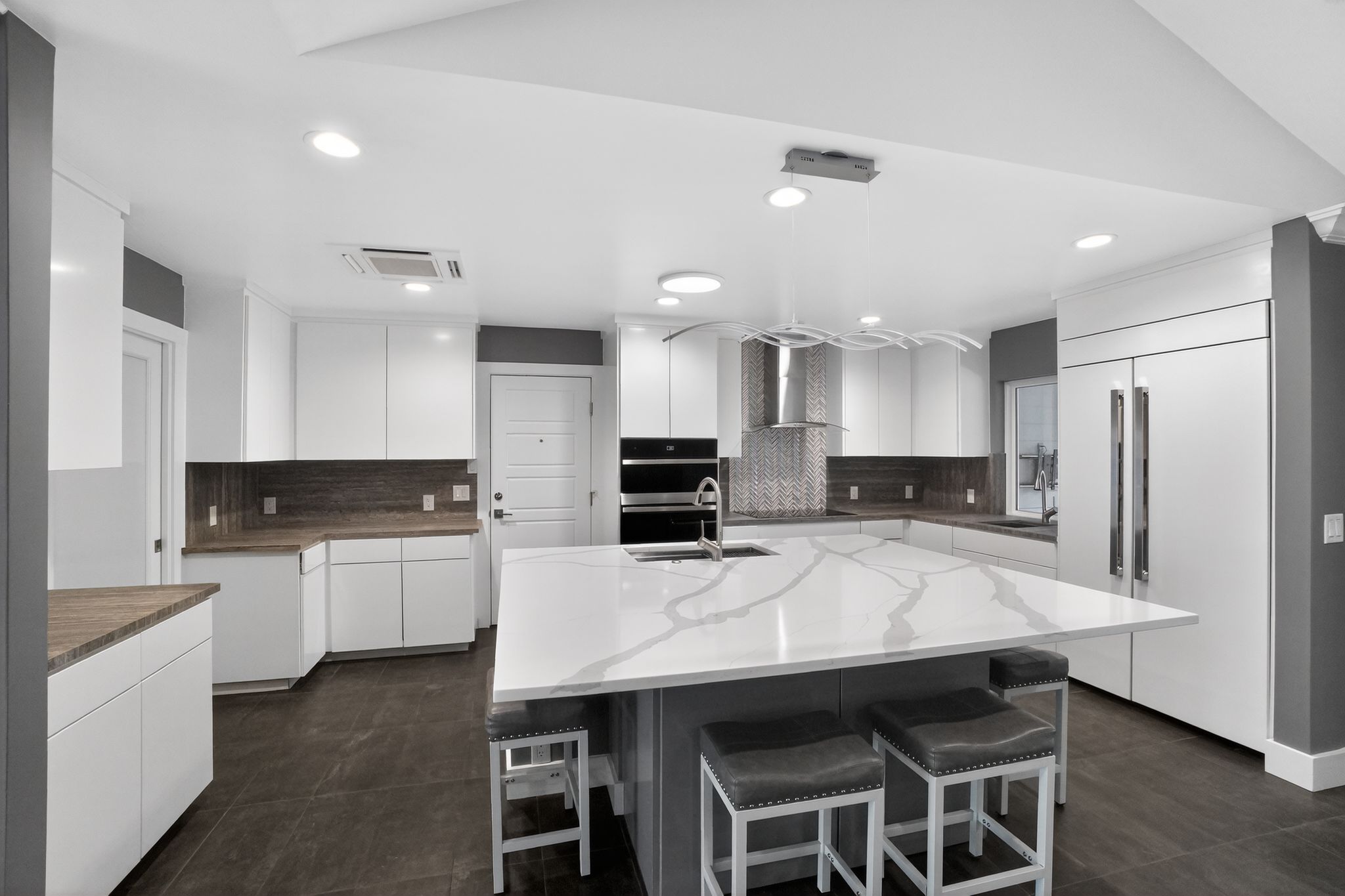 513 Meadowbrook Drive Georgetown, TX 78628 - Photo 10 of 22 a kitchen with stainless steel appliances kitchen island a table and chairs in it