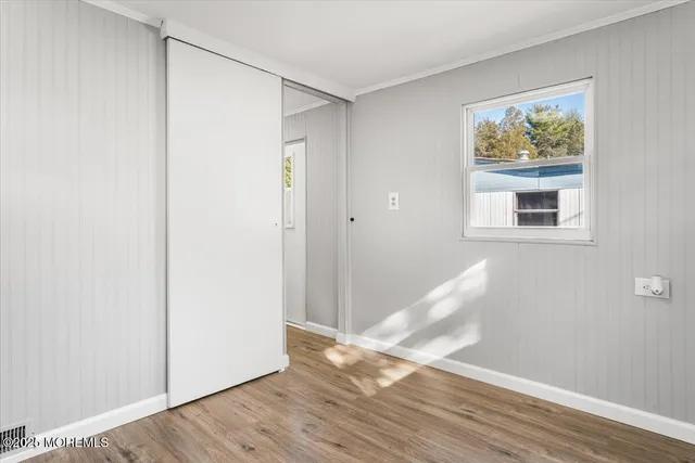 a view of livingroom with hardwood floor and hallway