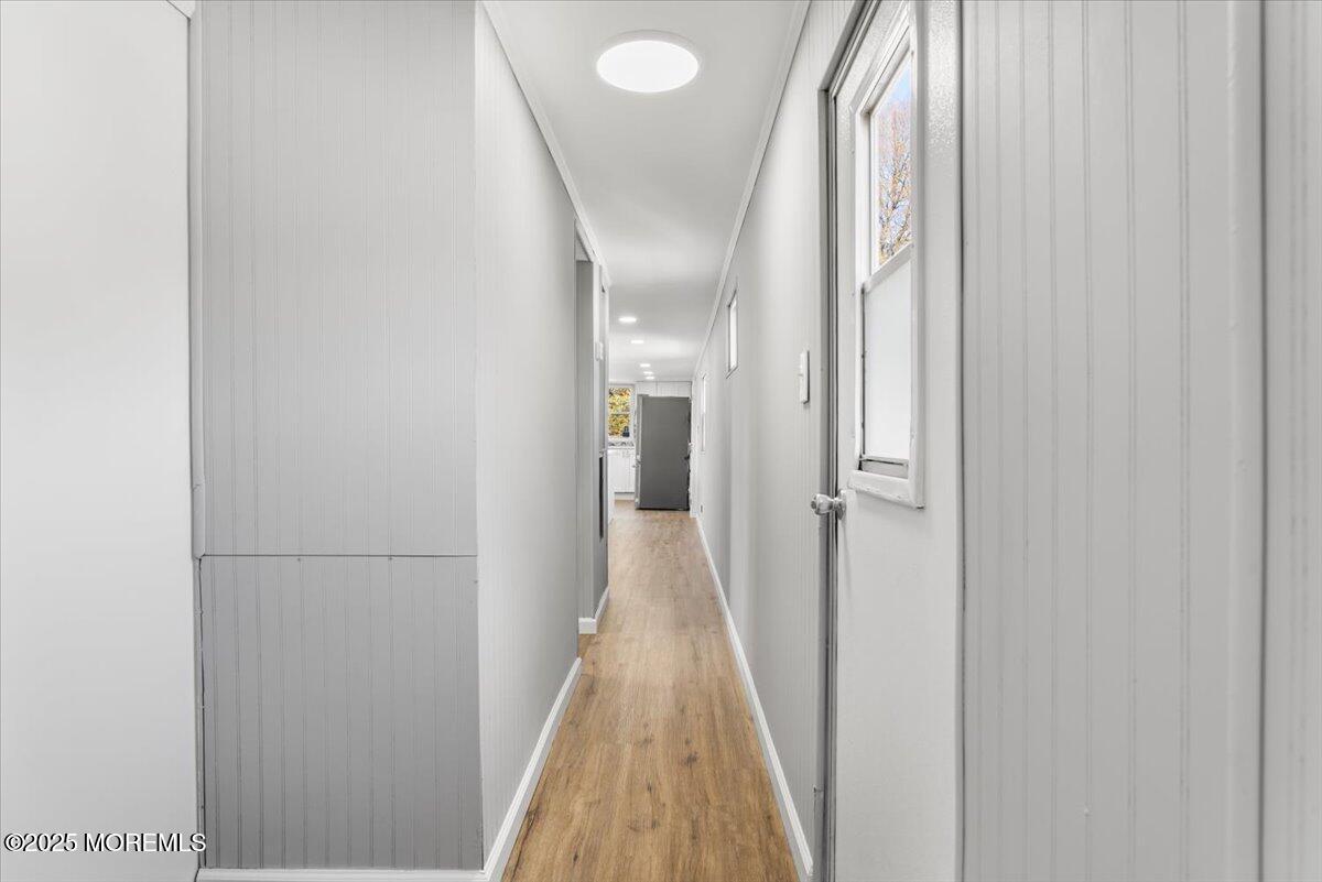 114 Cookstown New Egypt Road, Unit C7 Wrightstown, NJ 08562 - Photo 24 of 30 a view of a hallway with wooden floor and glass doors