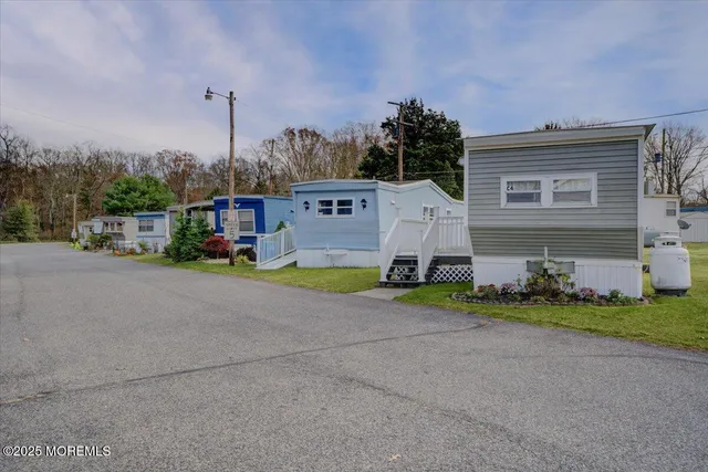 a view of street with parked cars