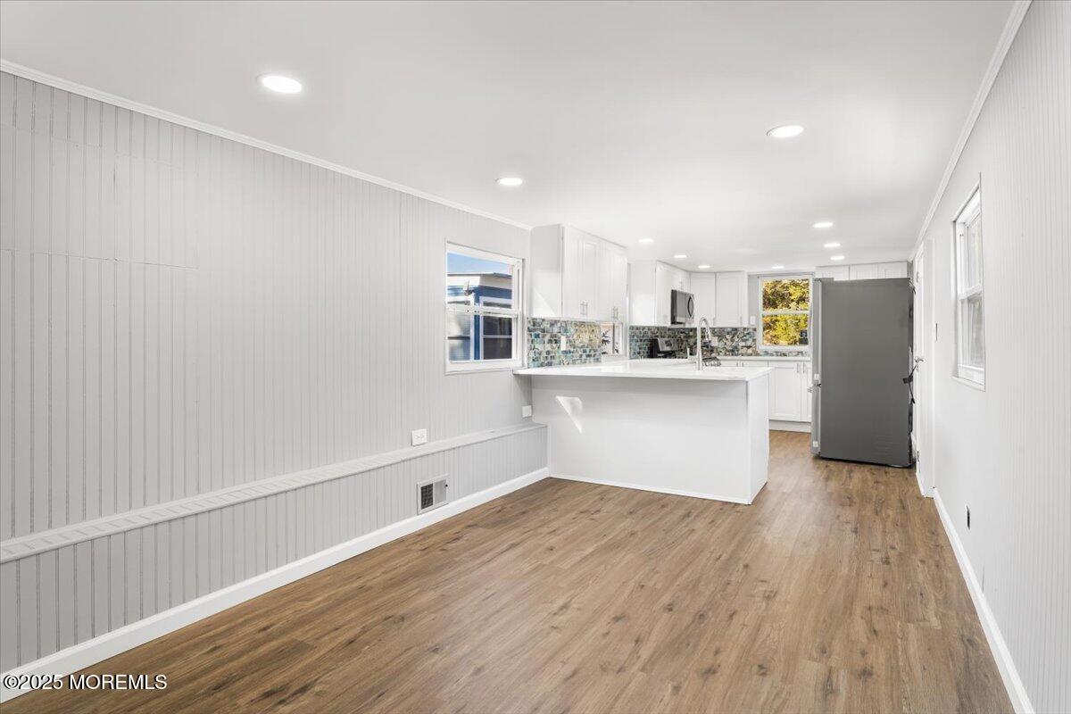 114 Cookstown New Egypt Road, Unit C7 Wrightstown, NJ 08562 - Photo 10 of 30 a kitchen with stainless steel appliances a refrigerator sink and white cabinets