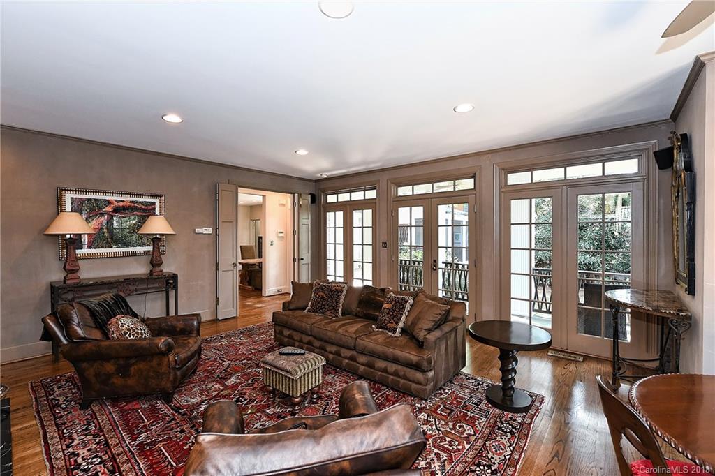 1626 Queens Road West Charlotte, NC 28207 - Photo 13 of 36 a living room with furniture and a floor to ceiling window