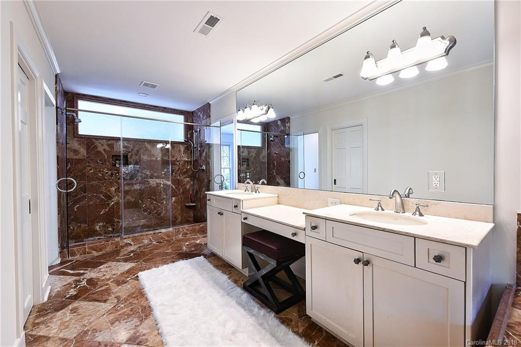 1626 Queens Road West Charlotte, NC 28207 - Photo 17 of 36 a view of a bathroom sink and mirror