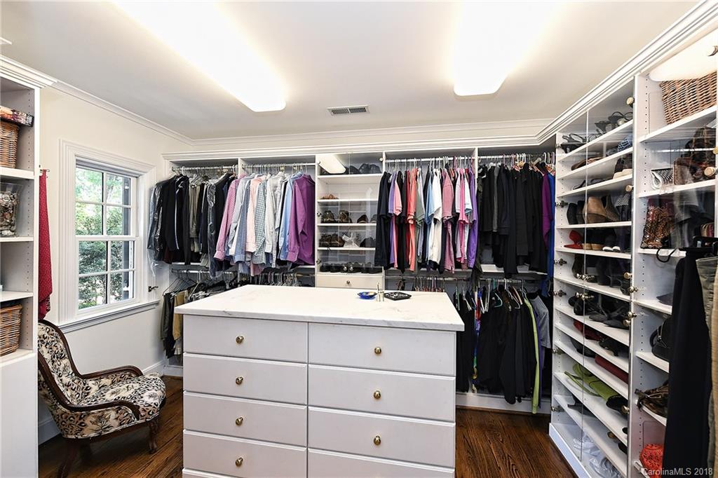 1626 Queens Road West Charlotte, NC 28207 - Photo 18 of 36 a view of walk in closet with clothes and shoes
