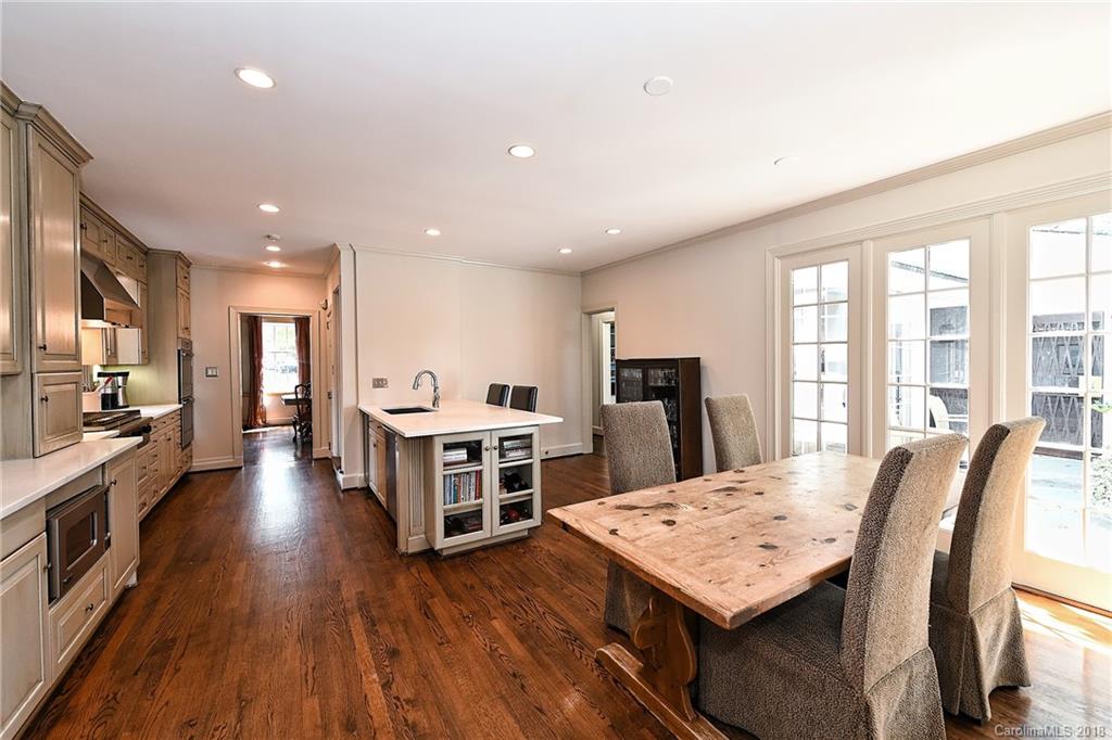 1626 Queens Road West Charlotte, NC 28207 - Photo 3 of 36 a large kitchen with a table and chairs