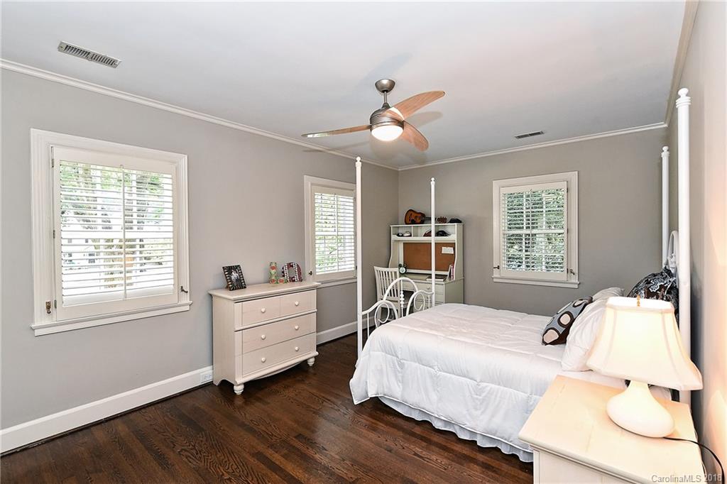 1626 Queens Road West Charlotte, NC 28207 - Photo 21 of 36 a bedroom with a bed and a large window