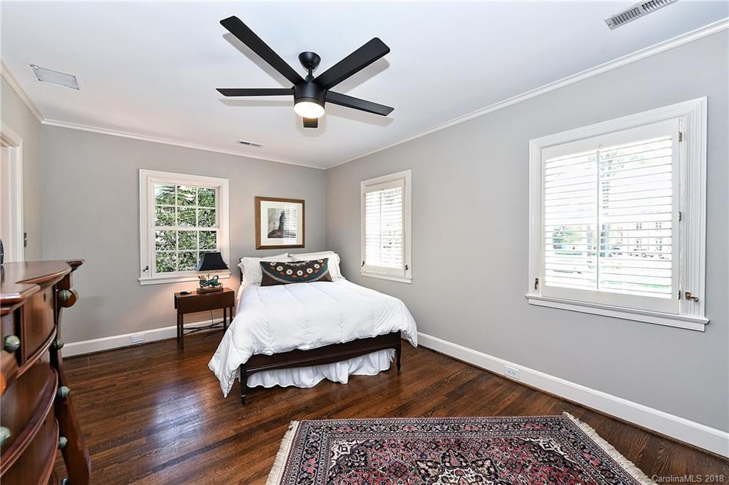 1626 Queens Road West Charlotte, NC 28207 - Photo 23 of 36 a bed sitting in a bedroom next to a window