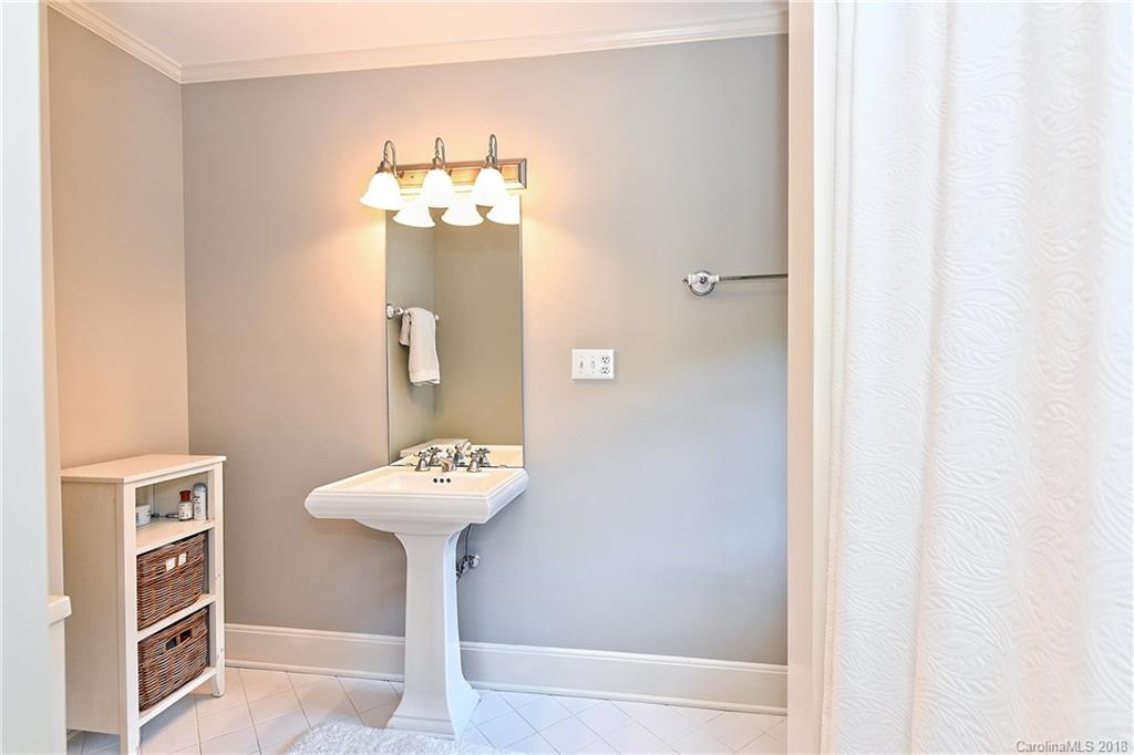 1626 Queens Road West Charlotte, NC 28207 - Photo 24 of 36 a bathroom with a sink and a mirror