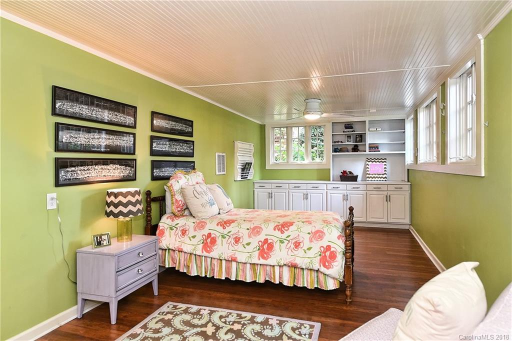 1626 Queens Road West Charlotte, NC 28207 - Photo 27 of 36 a bedroom with a bed and wooden floor