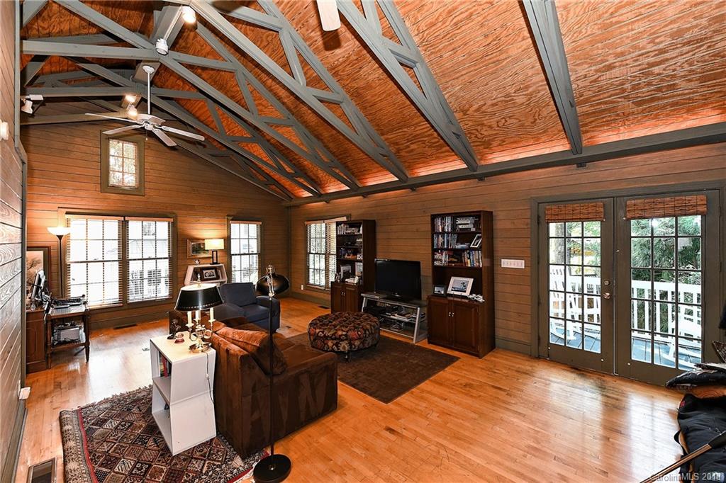 1626 Queens Road West Charlotte, NC 28207 - Photo 33 of 36 a living room with furniture large window and wooden floor
